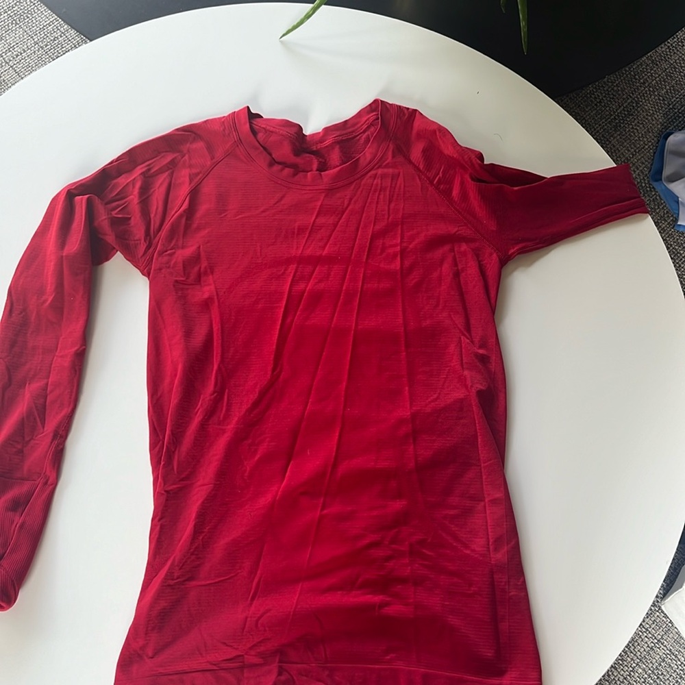 Dark red long sleeved athletic top